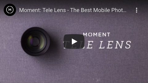 Screenshot eines YouTube-Videos mit dem Titel „Moment: Teleobjektiv – Das beste Handyfoto …“, das ein Moment-Kameraobjektiv auf einer Stoffoberfläche zeigt, wobei die Worte „Moment-Teleobjektiv“ sichtbar sind. Die Videodauer und die Steuersymbole sind unten teilweise sichtbar.